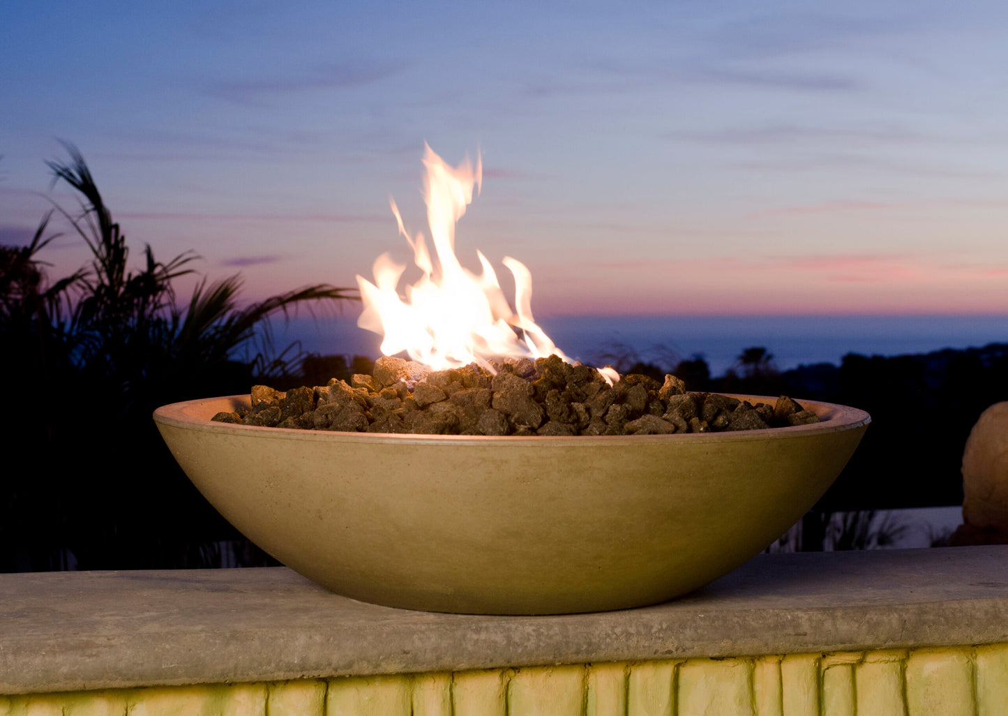 American Fyre Designs Marseille 32-inch GFRC fire bowl in outdoor setting