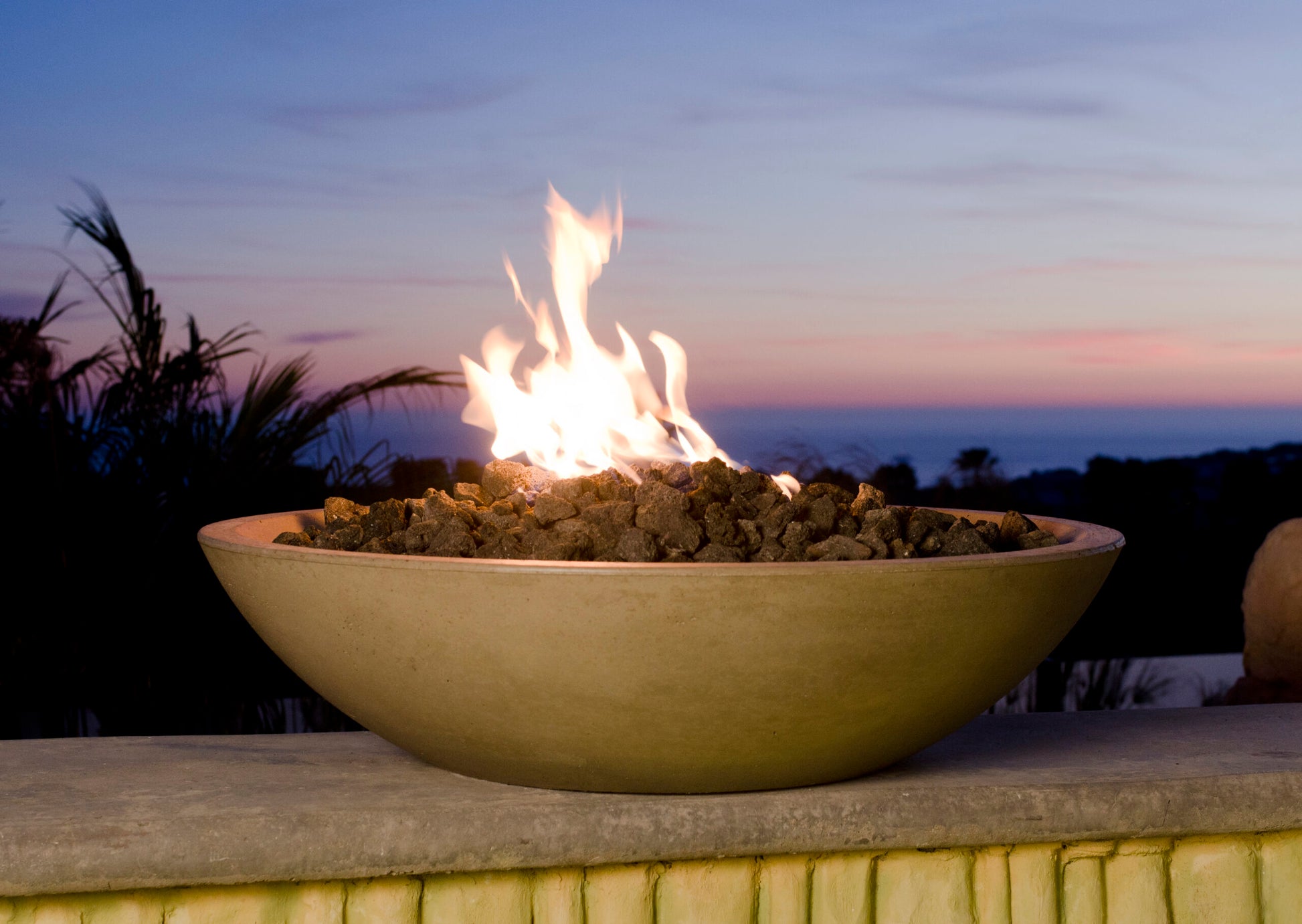 American Fyre Designs Marseille 32-inch GFRC fire bowl in outdoor setting