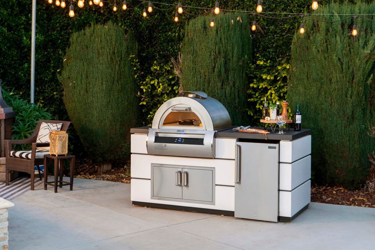 Fire Magic Aurora pizza oven lifestyle view with outdoor kitchen