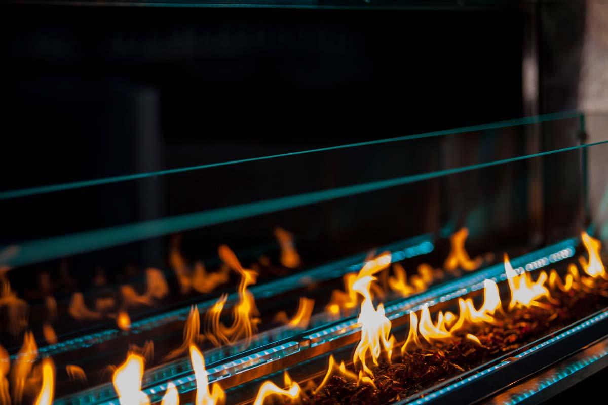 Kalea Bay 48 outdoor gas fireplace lifestyle view