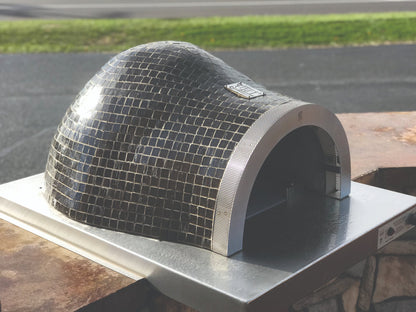HPC Forno Villa Series dome pizza oven with mosaic tile design outdoors